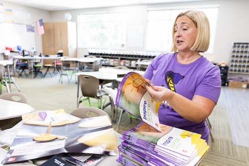 A staff member reviews curriculum